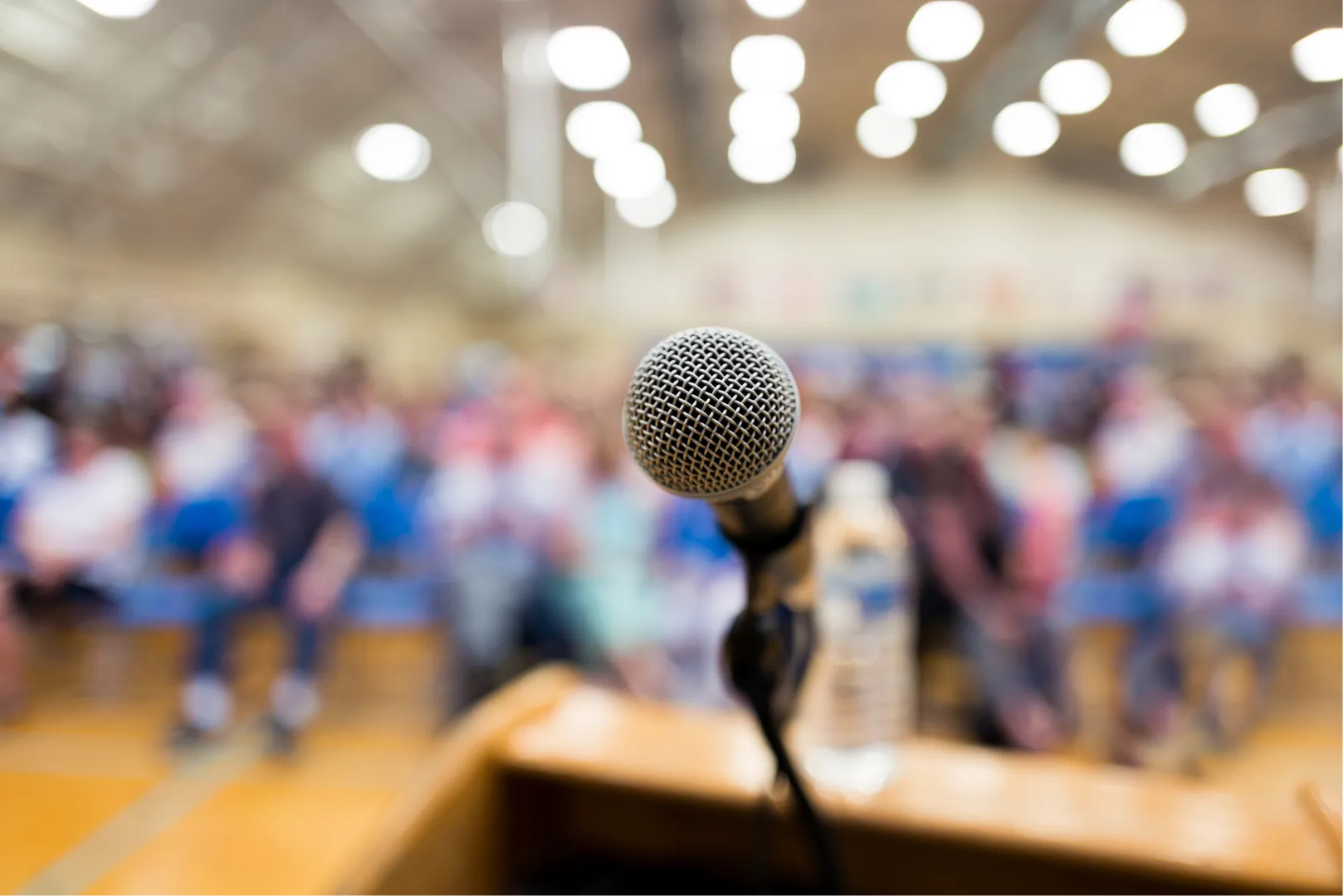 Microphone in front of crowded room